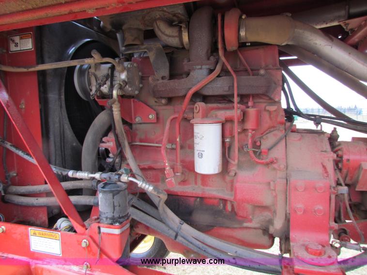 image for item A3511 2000 New Holland HW320 self propelled swather