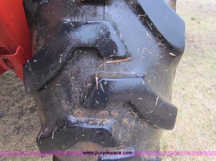 image for item A3511 2000 New Holland HW320 self propelled swather