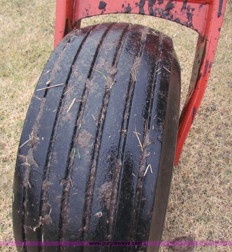 image for item A3511 2000 New Holland HW320 self propelled swather