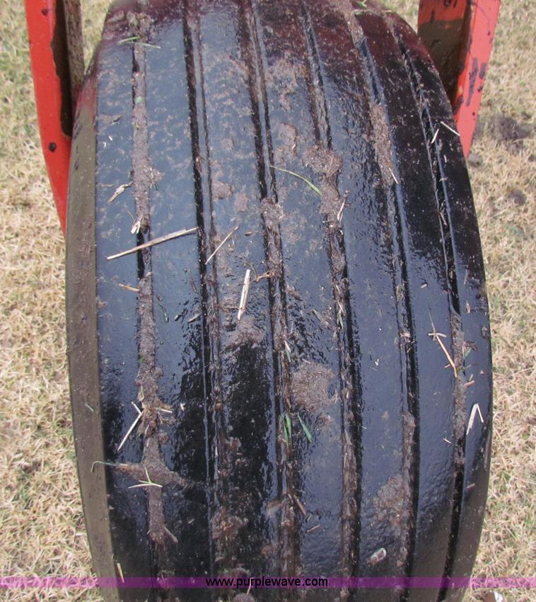 image for item A3511 2000 New Holland HW320 self propelled swather