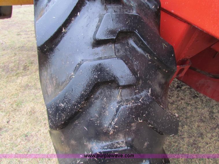 image for item A3511 2000 New Holland HW320 self propelled swather