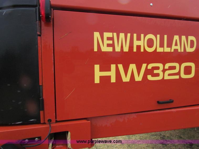 image for item A3511 2000 New Holland HW320 self propelled swather