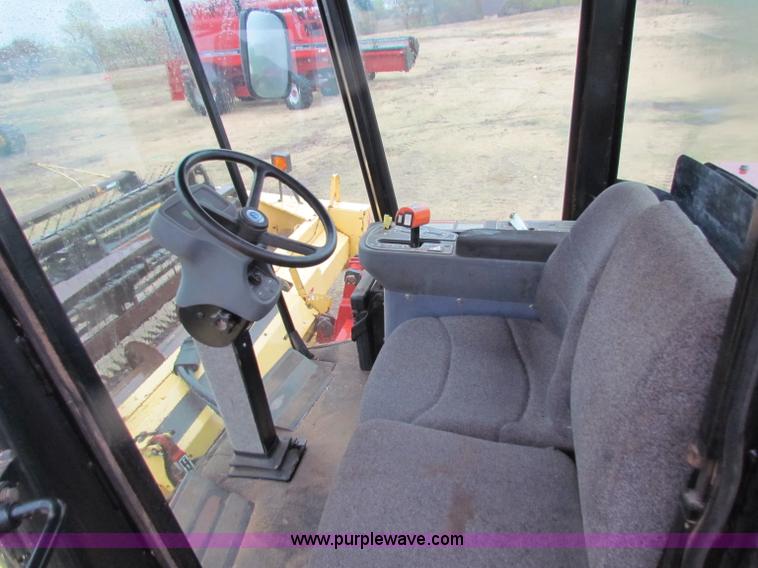 image for item A3511 2000 New Holland HW320 self propelled swather