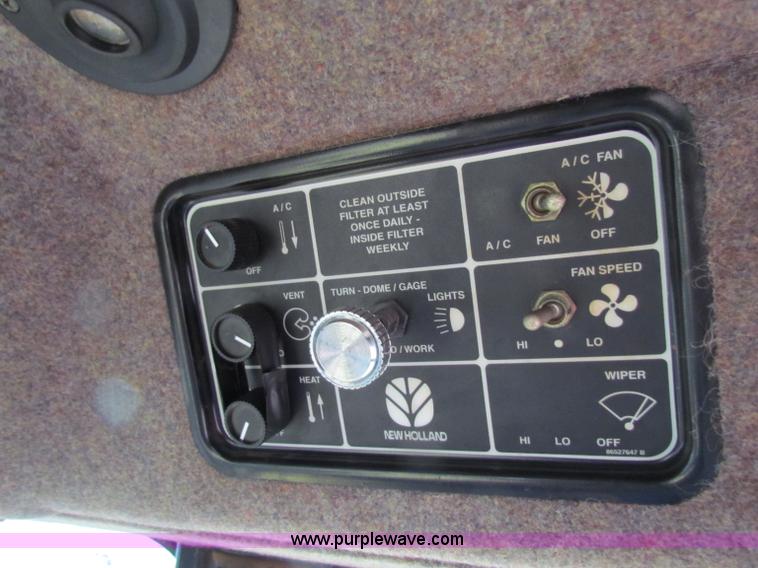 image for item A3511 2000 New Holland HW320 self propelled swather