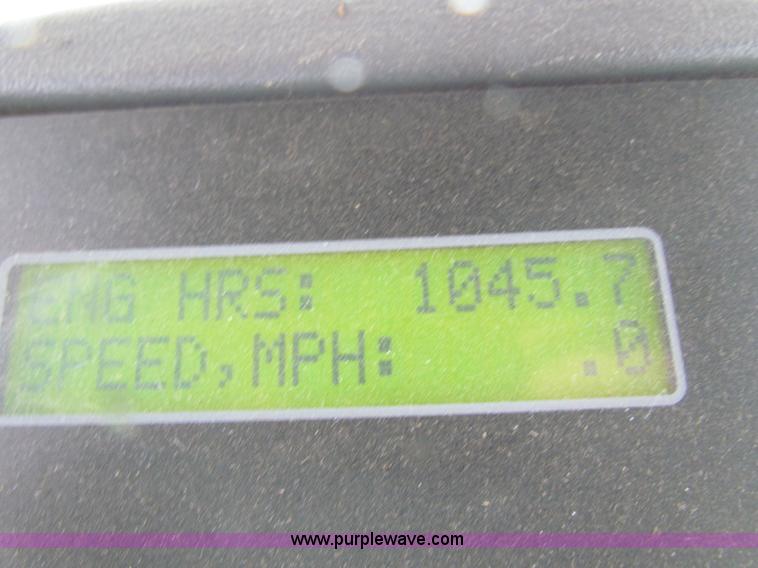 image for item A3511 2000 New Holland HW320 self propelled swather