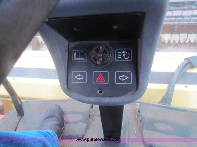 image for item A3511 2000 New Holland HW320 self propelled swather