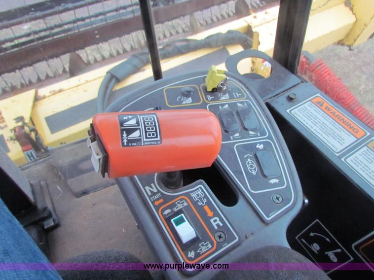 image for item A3511 2000 New Holland HW320 self propelled swather