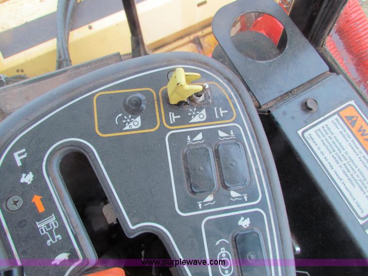 image for item A3511 2000 New Holland HW320 self propelled swather