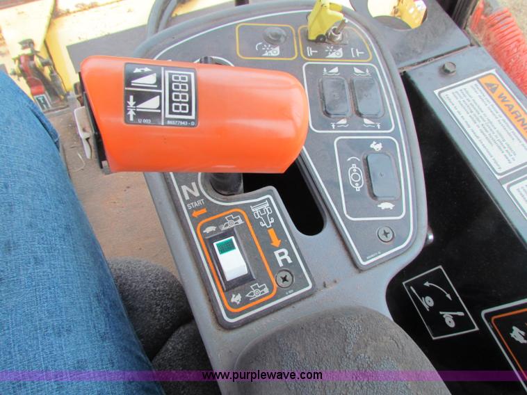 image for item A3511 2000 New Holland HW320 self propelled swather