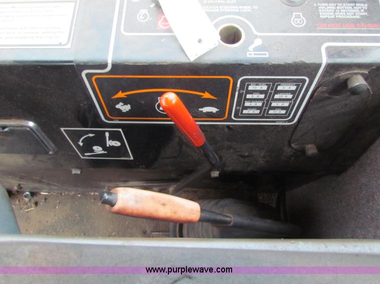 image for item A3511 2000 New Holland HW320 self propelled swather