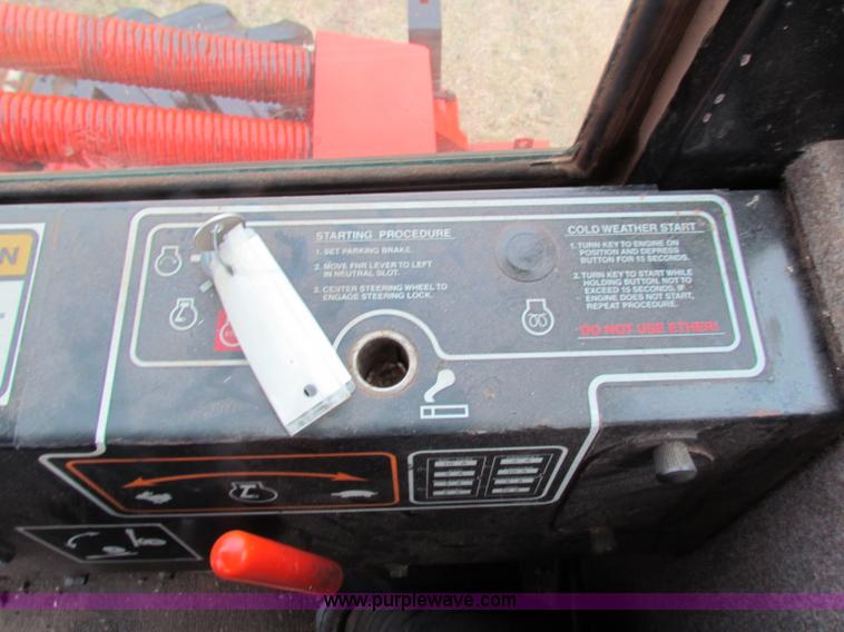 image for item A3511 2000 New Holland HW320 self propelled swather