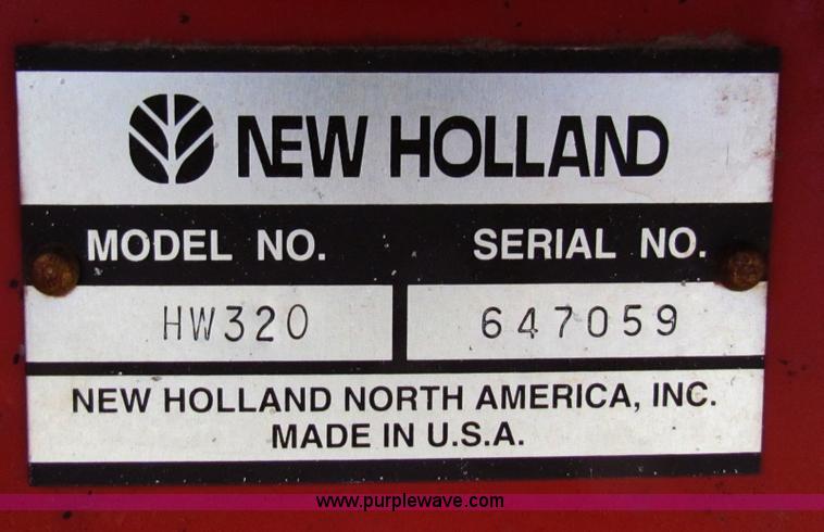 image for item A3511 2000 New Holland HW320 self propelled swather