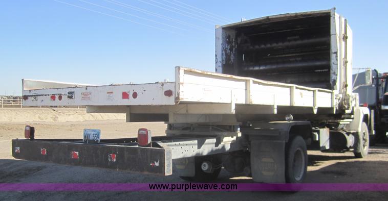 image for item B5534 1983 Ford LN800 bale feeder