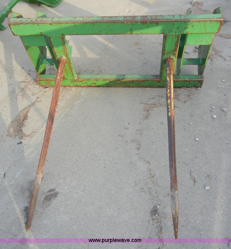 image for item H9089 John Deere 725 loader with bucket and bale spear