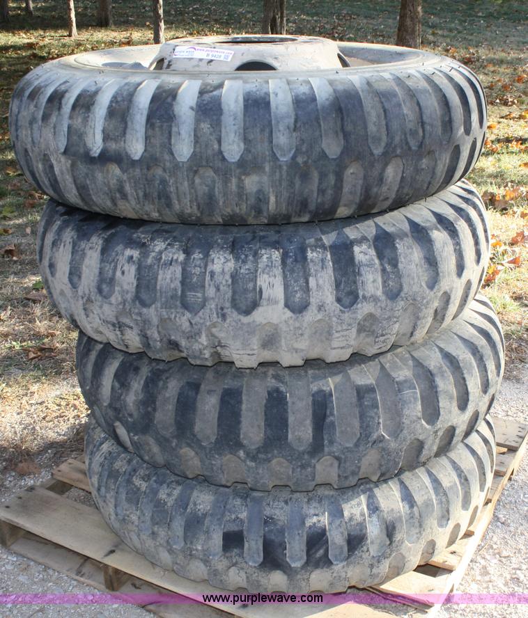 image for item B9428 (4) 11.00-20 tires and wheels