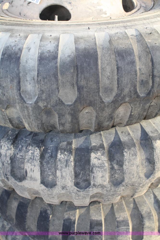image for item B9428 (4) 11.00-20 tires and wheels
