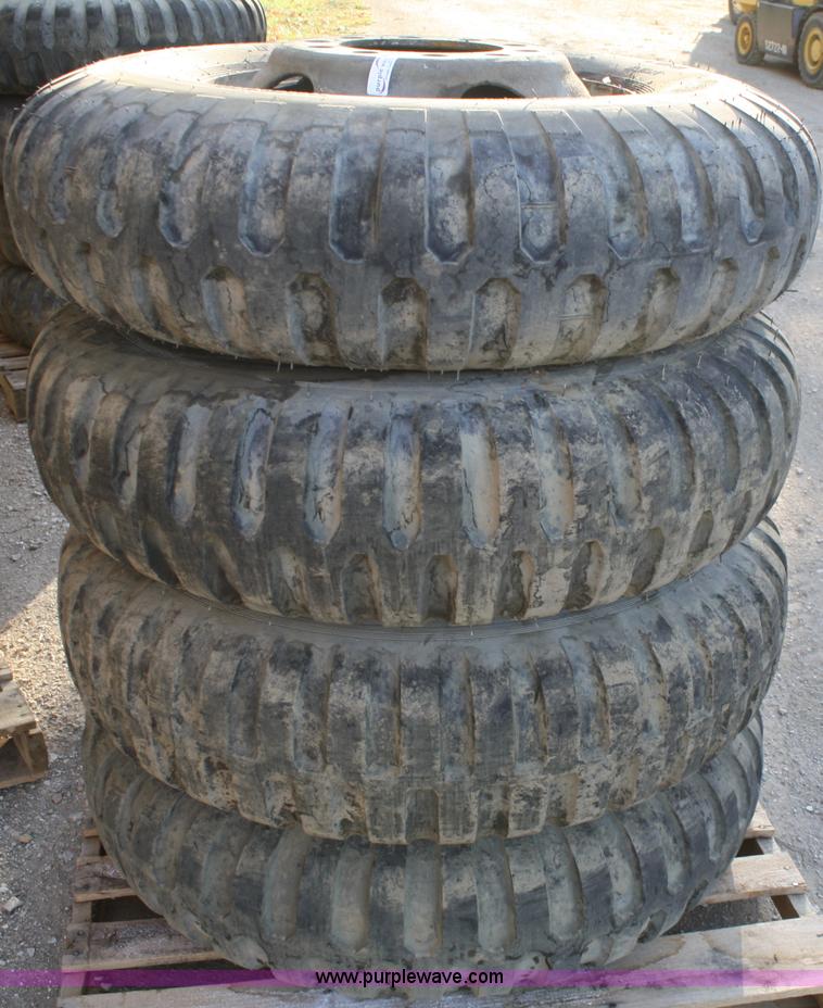 image for item B9430 (4) 11.00-20 tires and wheels