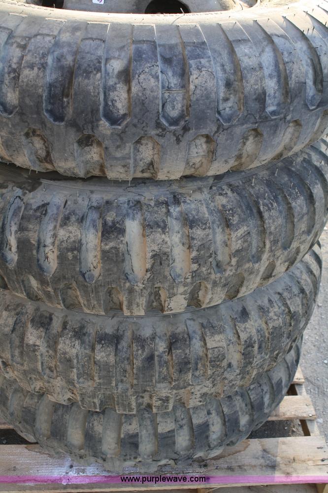 image for item B9430 (4) 11.00-20 tires and wheels