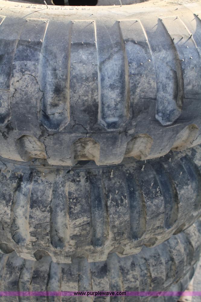 image for item B9430 (4) 11.00-20 tires and wheels