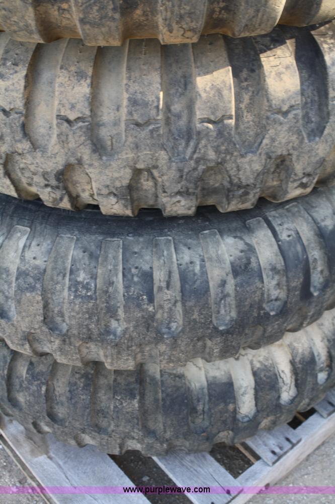 image for item B9431 (4) 11.00-20 tires and wheels