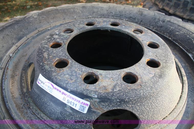 image for item B9431 (4) 11.00-20 tires and wheels