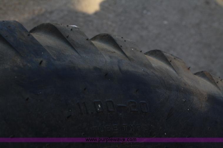 image for item B9431 (4) 11.00-20 tires and wheels
