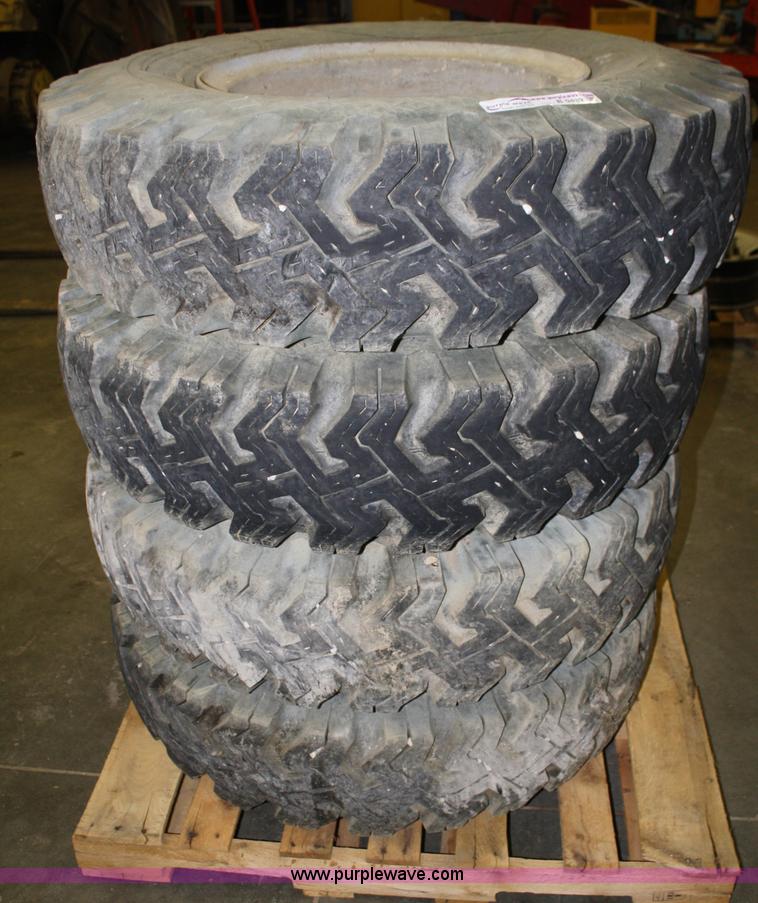 image for item B9432 (4) 10.00-20 tires and wheels
