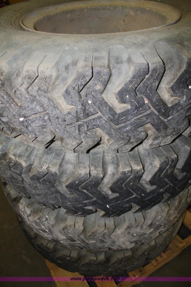 image for item B9432 (4) 10.00-20 tires and wheels