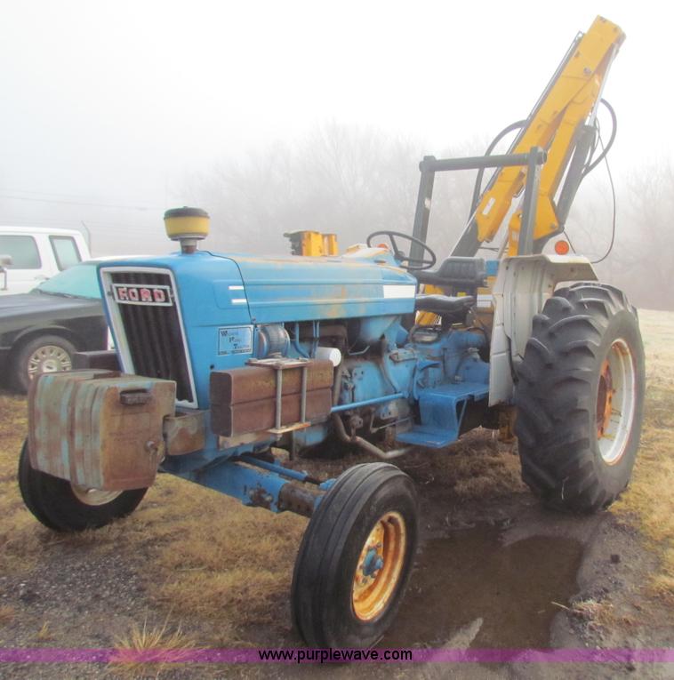 image for item B7018 1986 Ford 5900 tractor with flail boom mower
