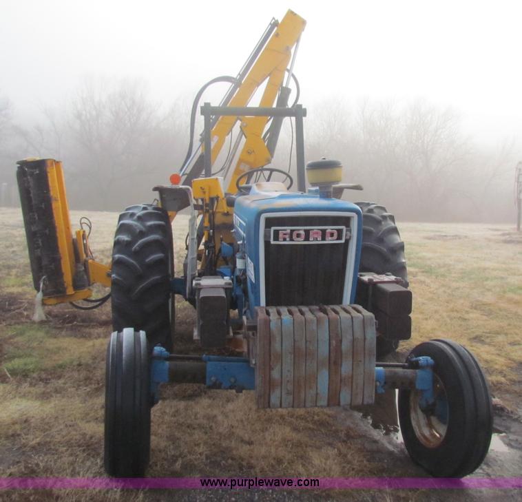 image for item B7018 1986 Ford 5900 tractor with flail boom mower