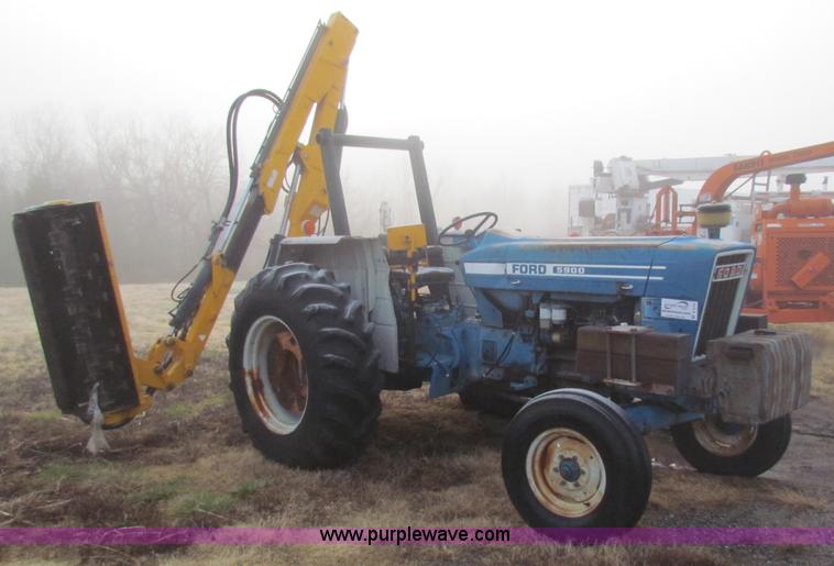 image for item B7018 1986 Ford 5900 tractor with flail boom mower