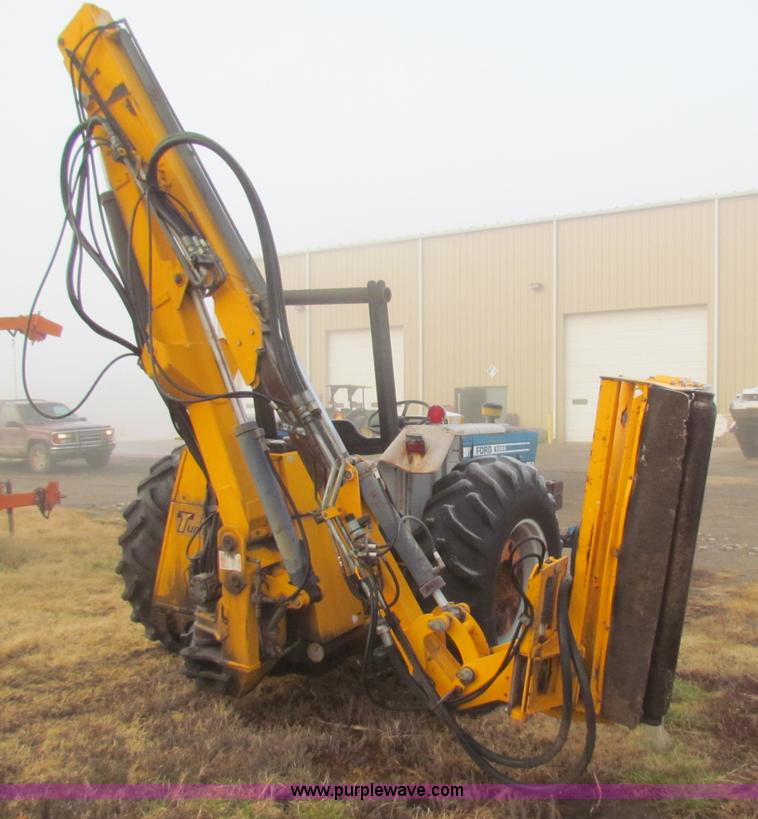 image for item B7018 1986 Ford 5900 tractor with flail boom mower