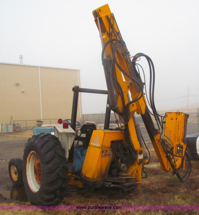 image for item B7018 1986 Ford 5900 tractor with flail boom mower
