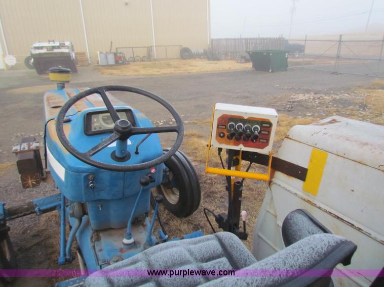 image for item B7018 1986 Ford 5900 tractor with flail boom mower