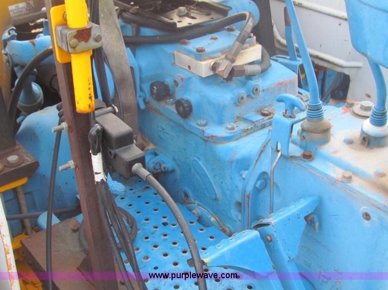 image for item B7018 1986 Ford 5900 tractor with flail boom mower