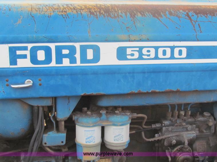 image for item B7018 1986 Ford 5900 tractor with flail boom mower