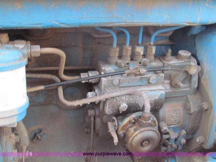 image for item B7018 1986 Ford 5900 tractor with flail boom mower