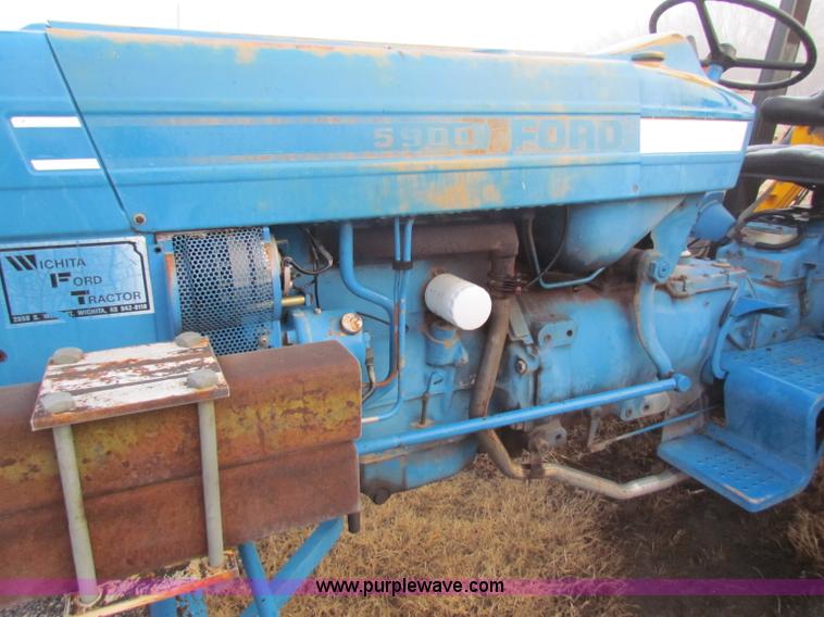 image for item B7018 1986 Ford 5900 tractor with flail boom mower