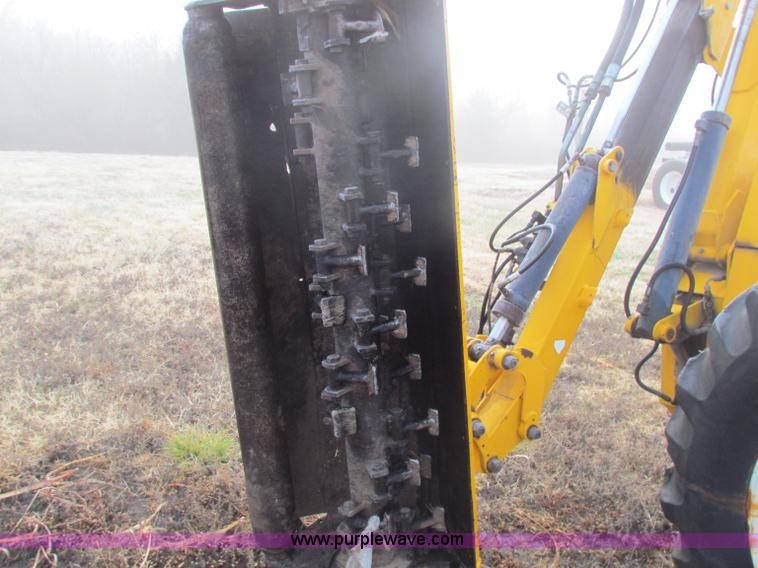 image for item B7018 1986 Ford 5900 tractor with flail boom mower