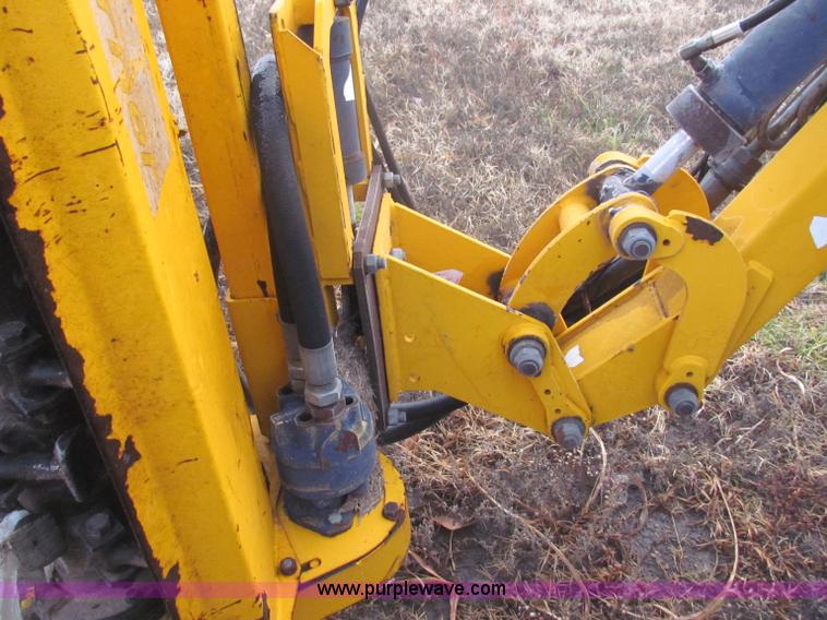 image for item B7018 1986 Ford 5900 tractor with flail boom mower