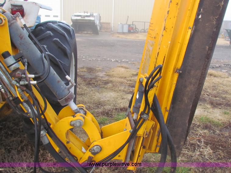 image for item B7018 1986 Ford 5900 tractor with flail boom mower