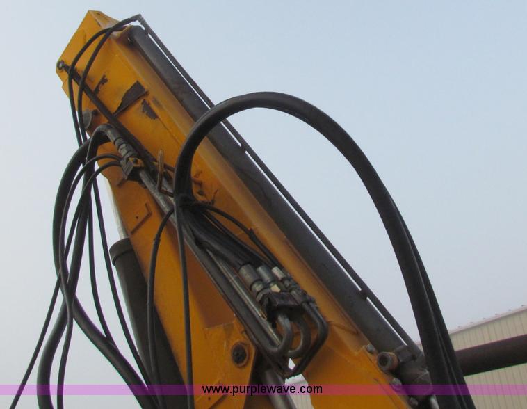 image for item B7018 1986 Ford 5900 tractor with flail boom mower