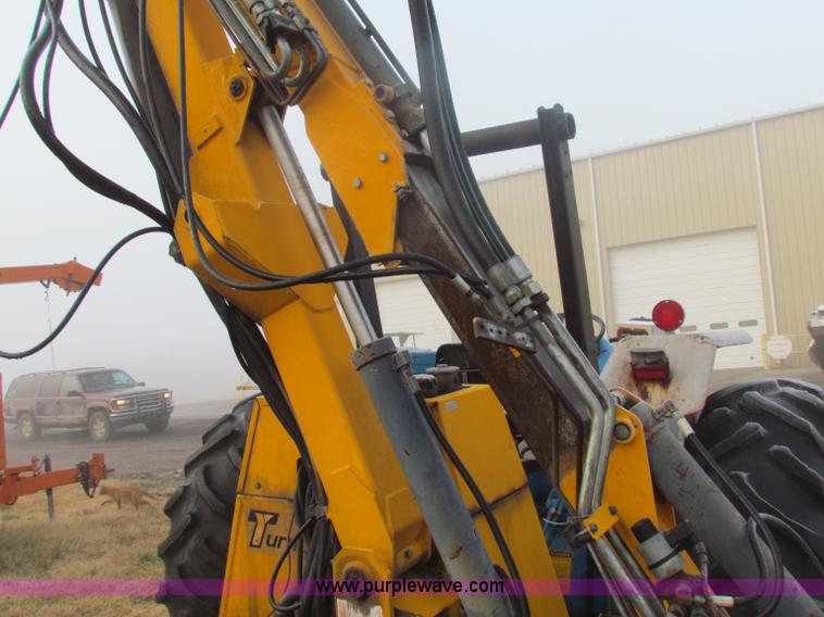 image for item B7018 1986 Ford 5900 tractor with flail boom mower