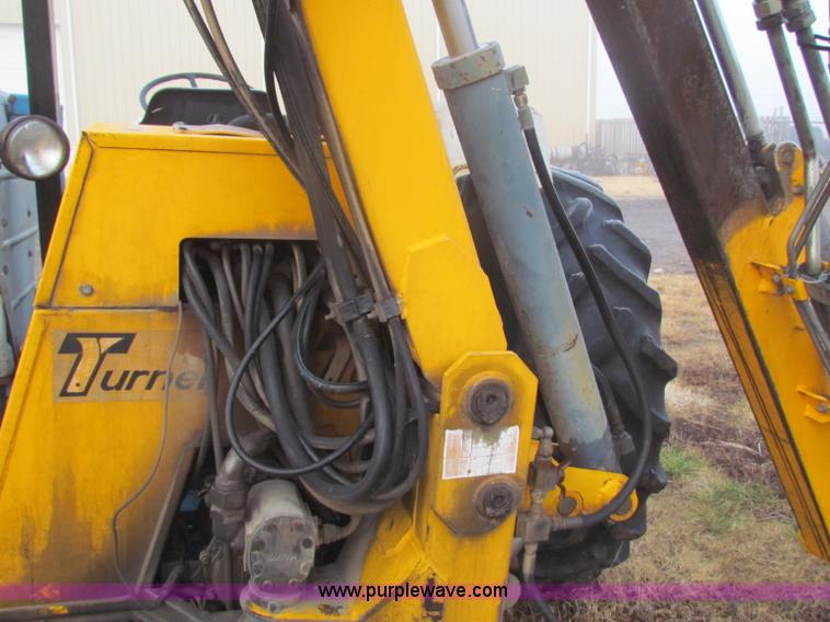 image for item B7018 1986 Ford 5900 tractor with flail boom mower