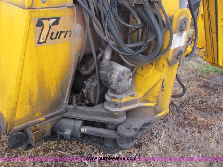 image for item B7018 1986 Ford 5900 tractor with flail boom mower