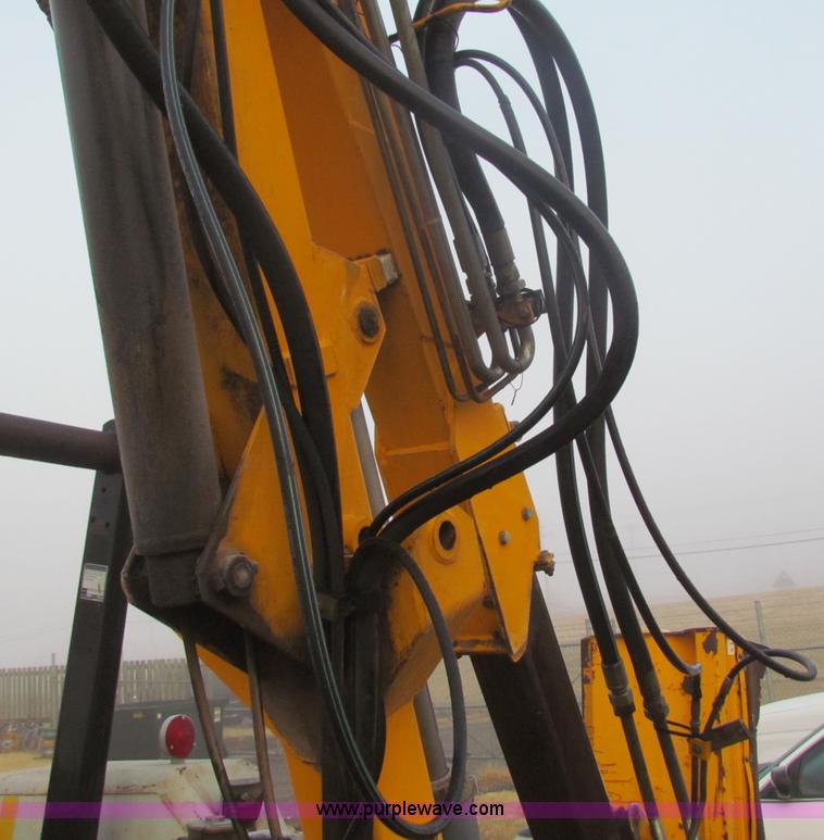 image for item B7018 1986 Ford 5900 tractor with flail boom mower