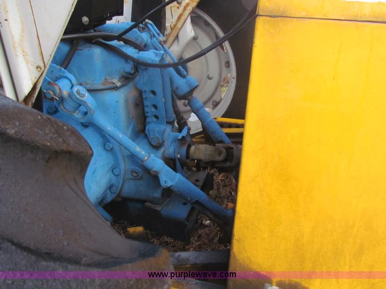 image for item B7018 1986 Ford 5900 tractor with flail boom mower