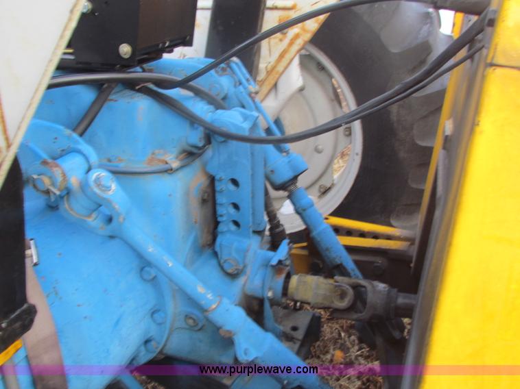 image for item B7018 1986 Ford 5900 tractor with flail boom mower