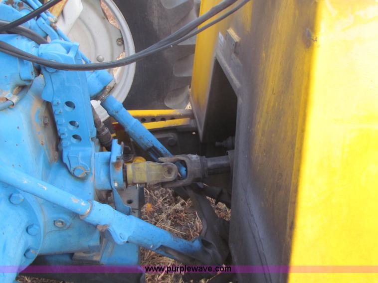 image for item B7018 1986 Ford 5900 tractor with flail boom mower