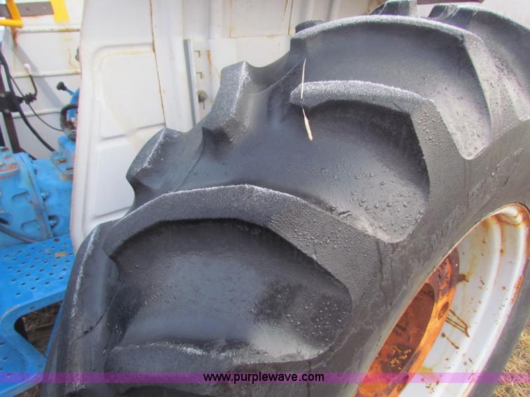 image for item B7018 1986 Ford 5900 tractor with flail boom mower